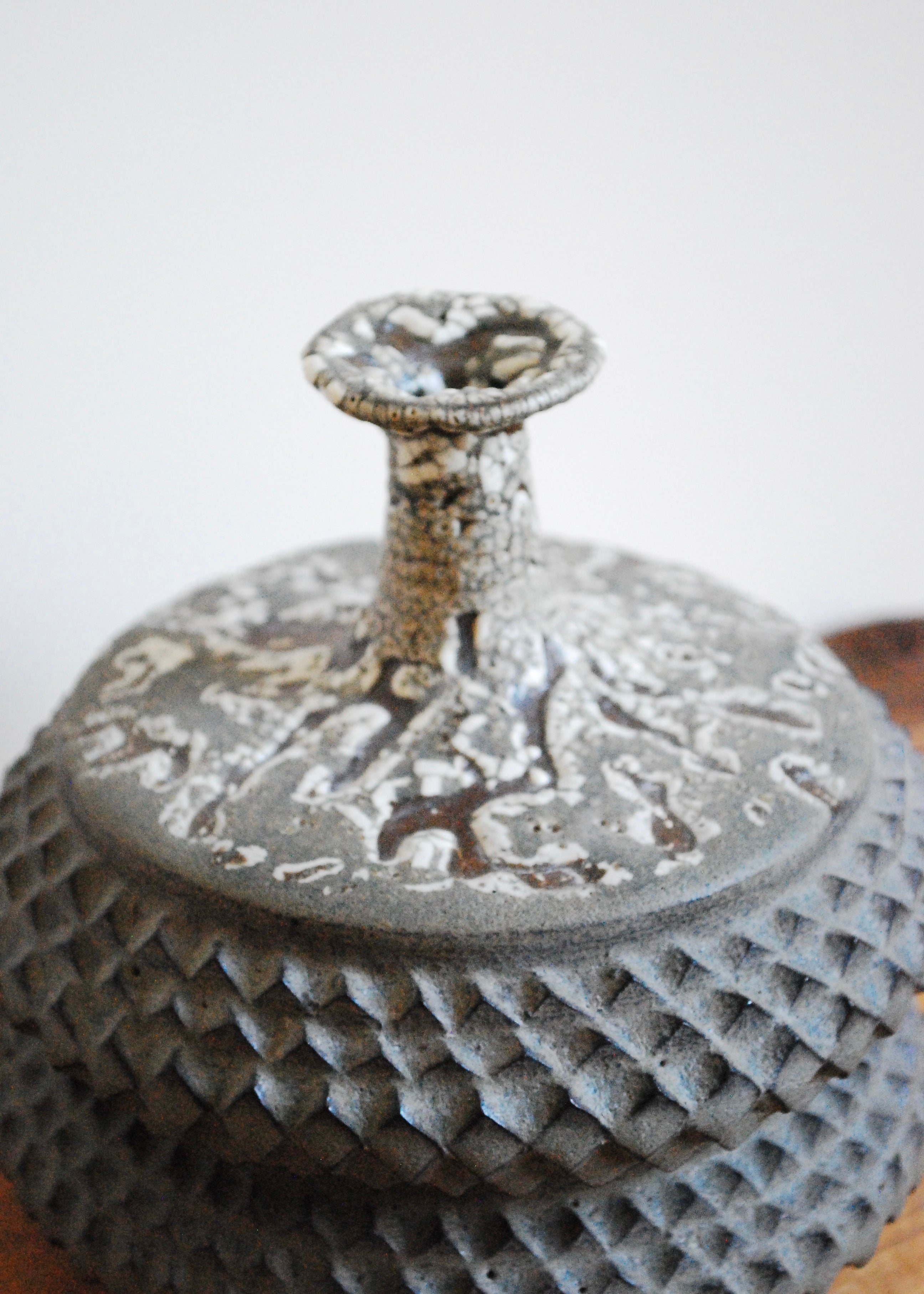 Handmade tramp art ceramic vase vessel with texture throughout and speckled glaze