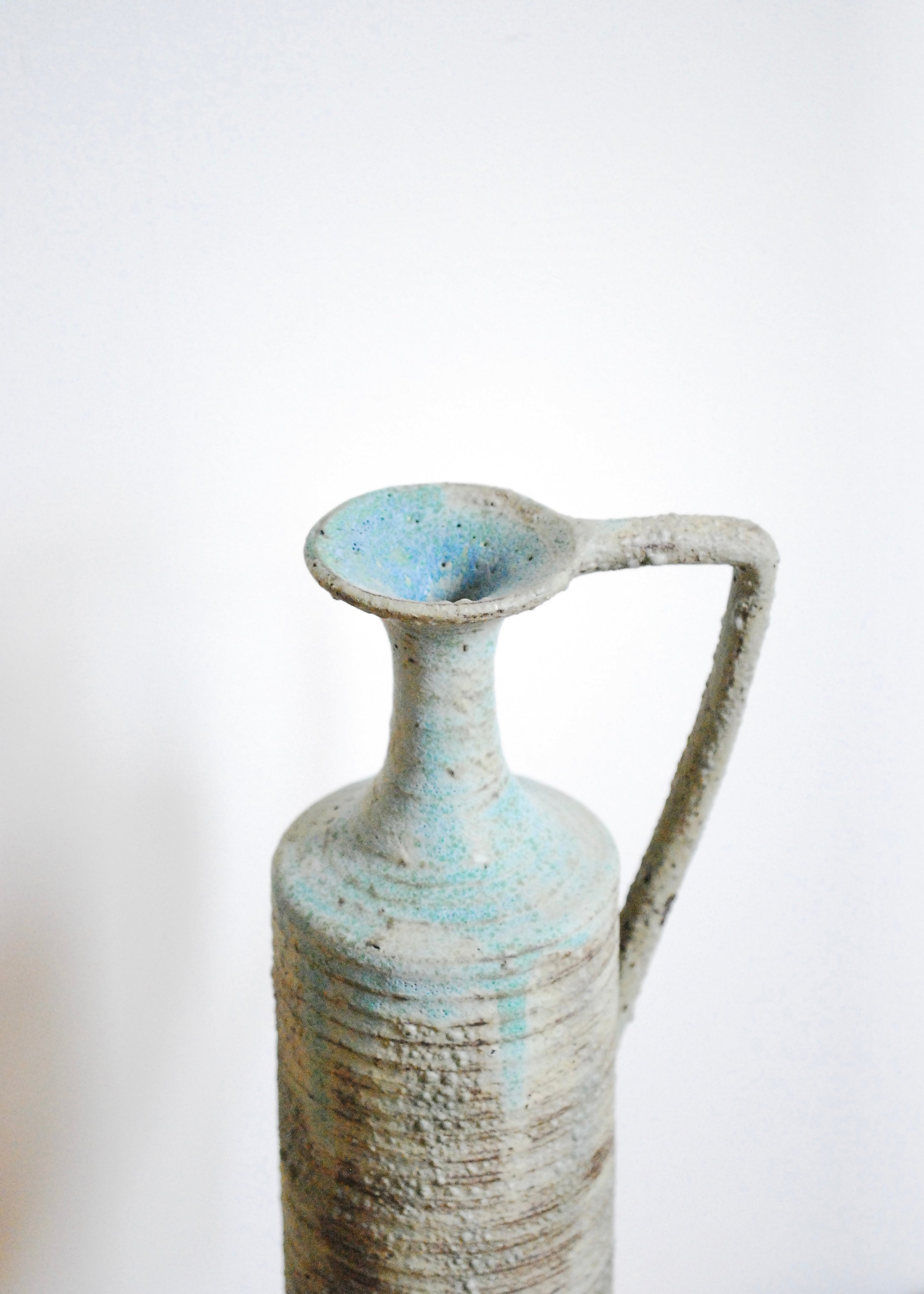Ornate handmade ceramic pitcher jug with handle and textural worn glaze in Sea foam and gray