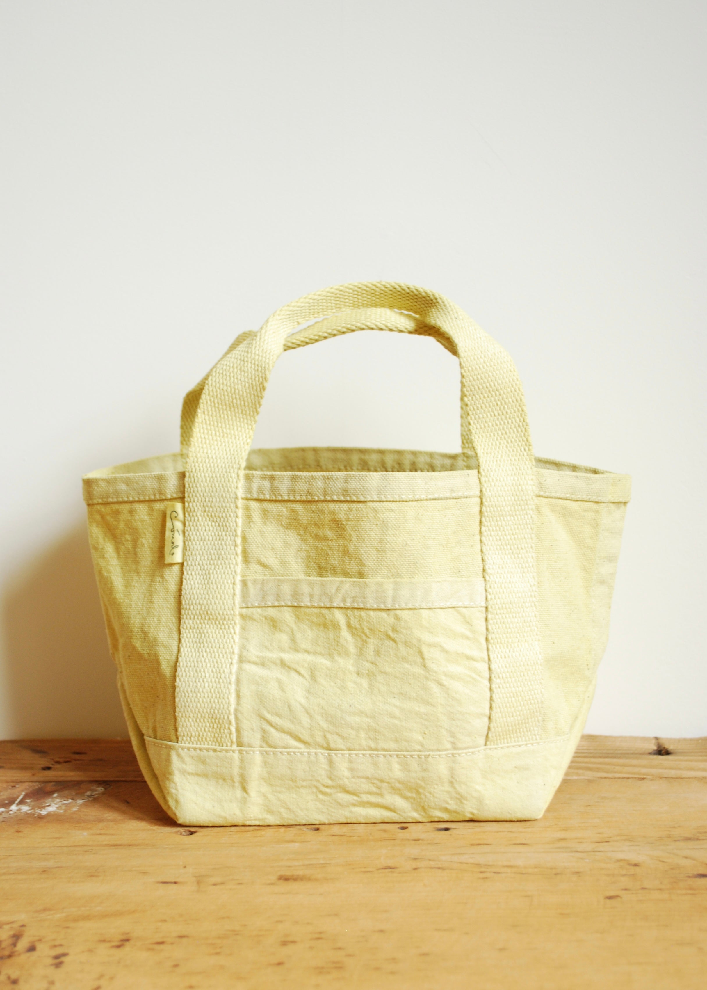 Natural dyed handmade canvas mini tote bag in yellow weld flower