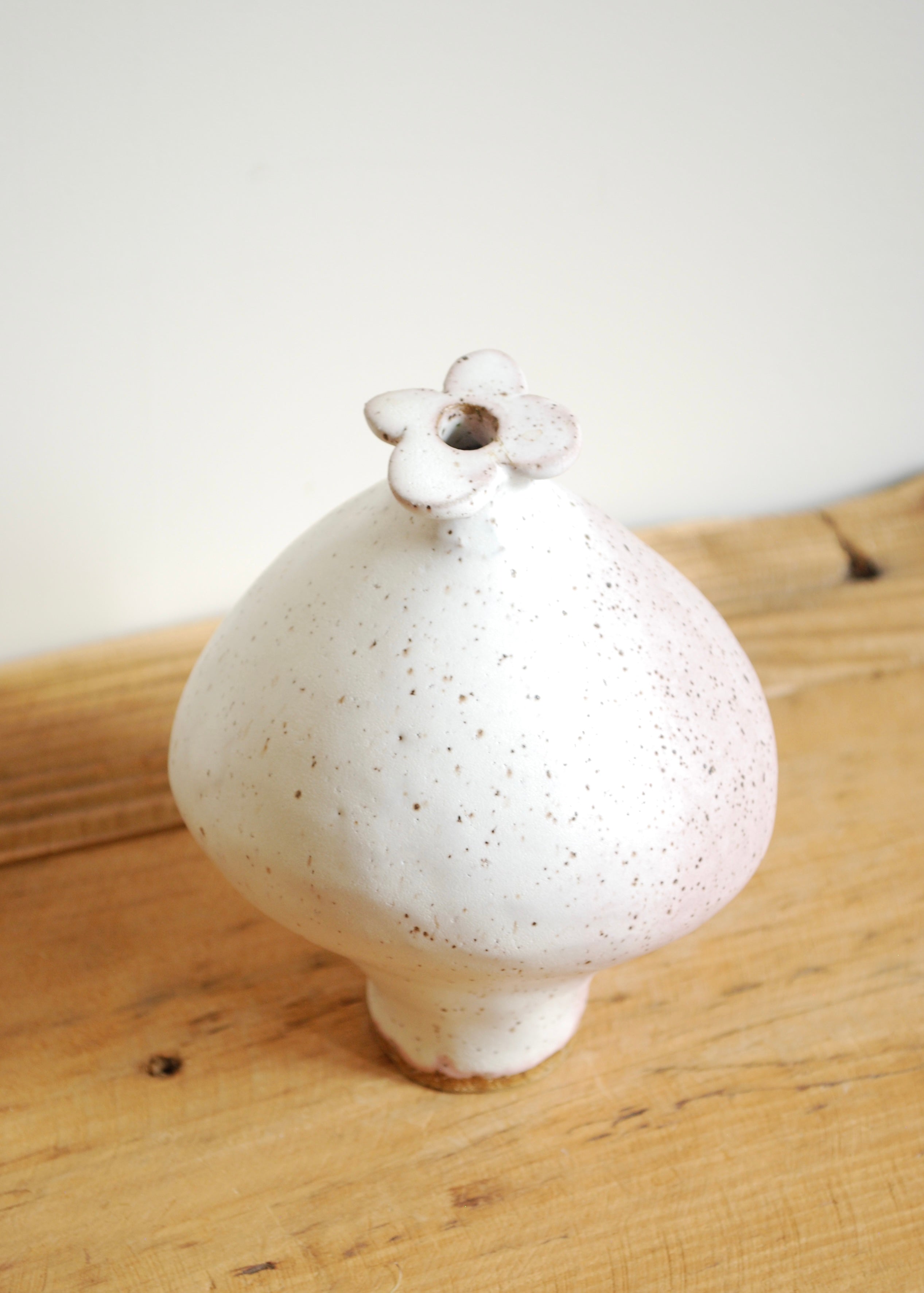 handmade speckled glaze ceramic mini blueberry shaped vase with pink hue