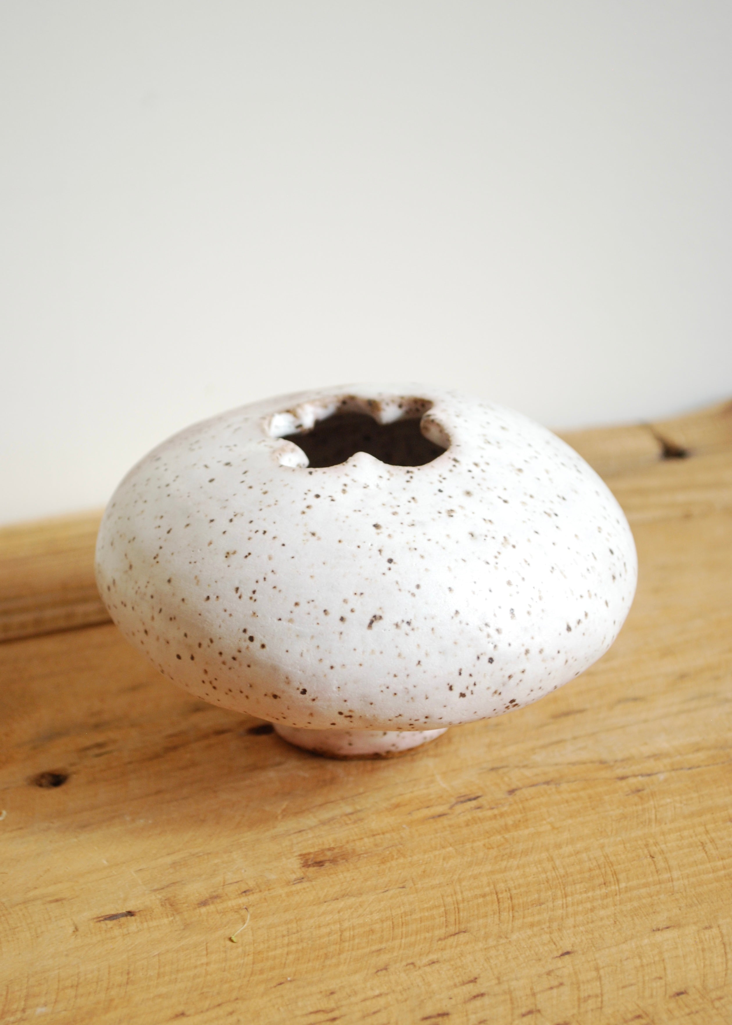 handmade speckled glaze ceramic mini blueberry shaped vase with pink hue