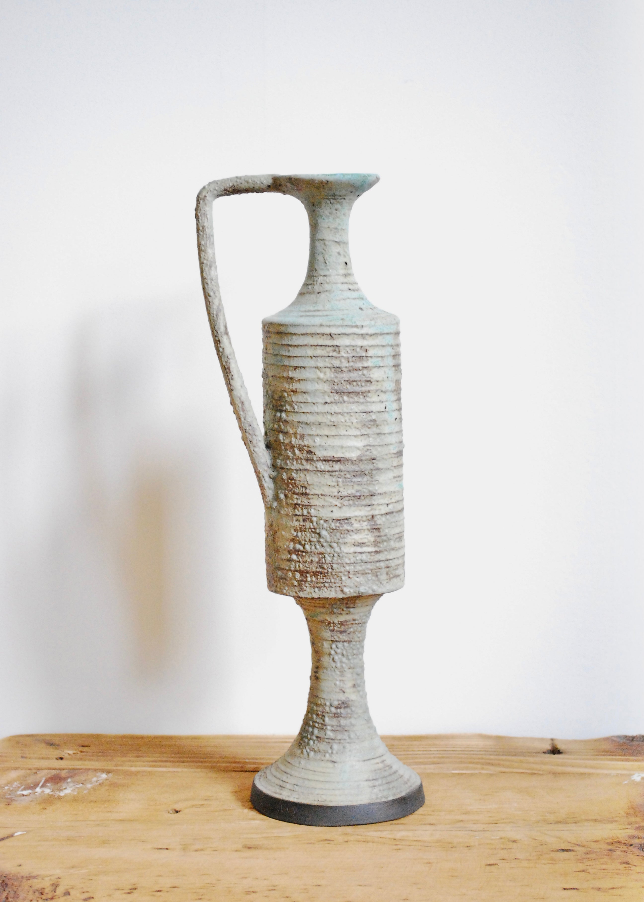 Ornate handmade ceramic pitcher jug with handle and textural worn glaze in Sea foam and gray