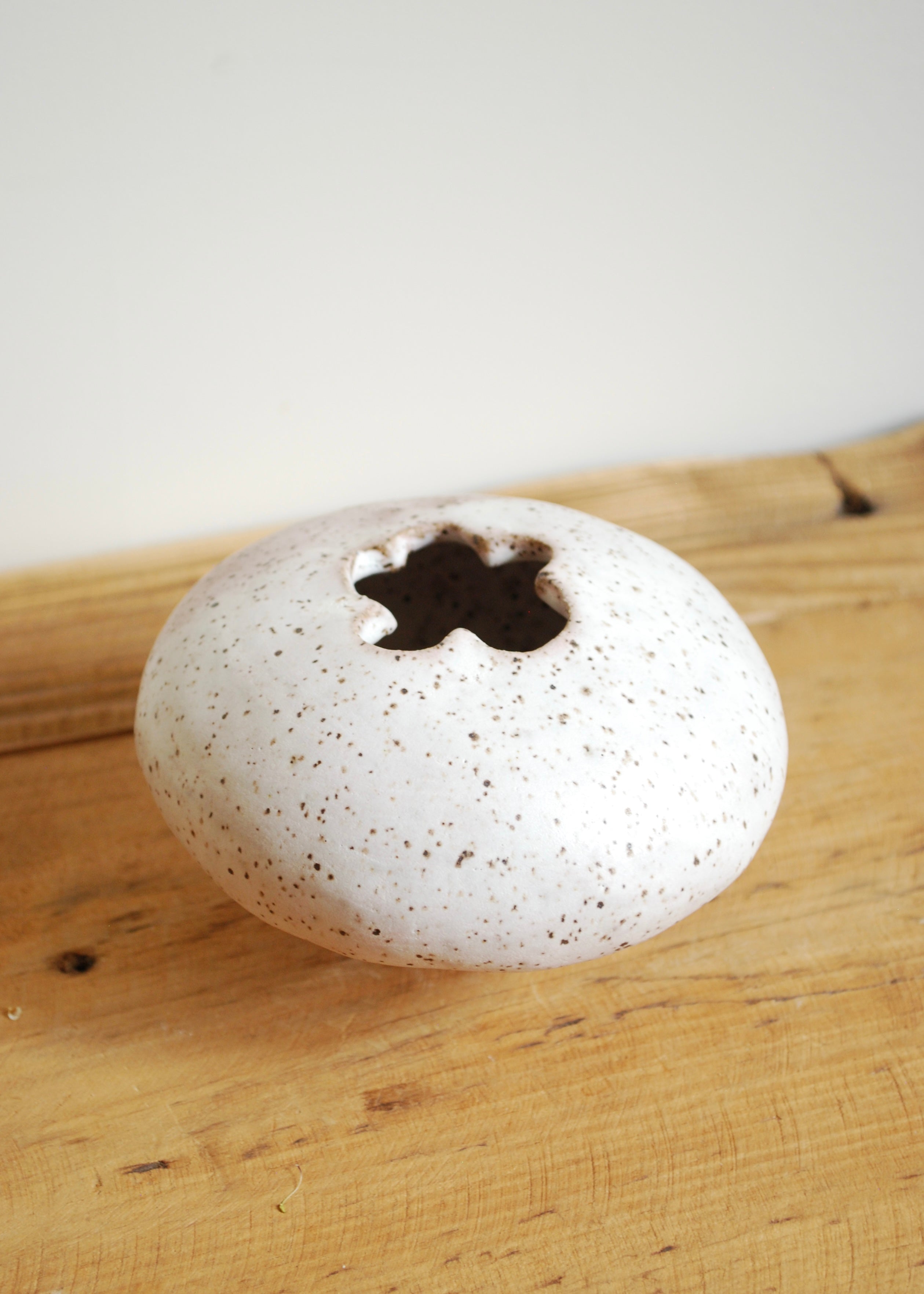 handmade speckled glaze ceramic mini blueberry shaped vase with pink hue