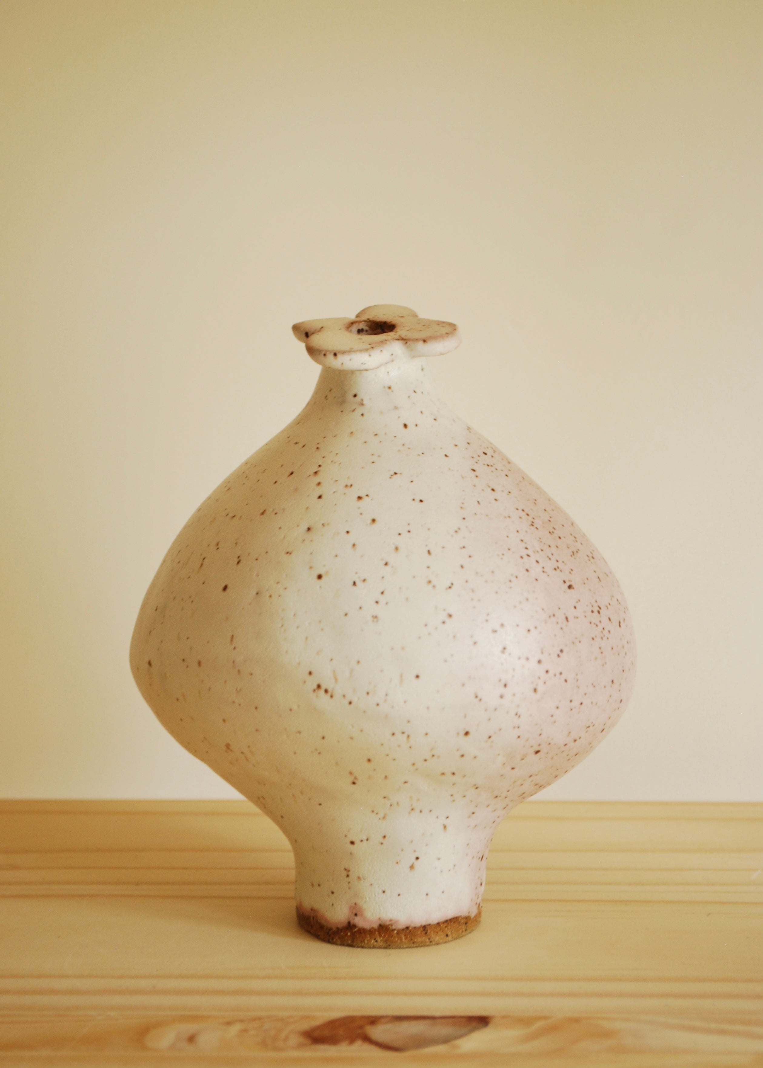 handmade speckled glaze ceramic mini blueberry shaped vase with pink hue