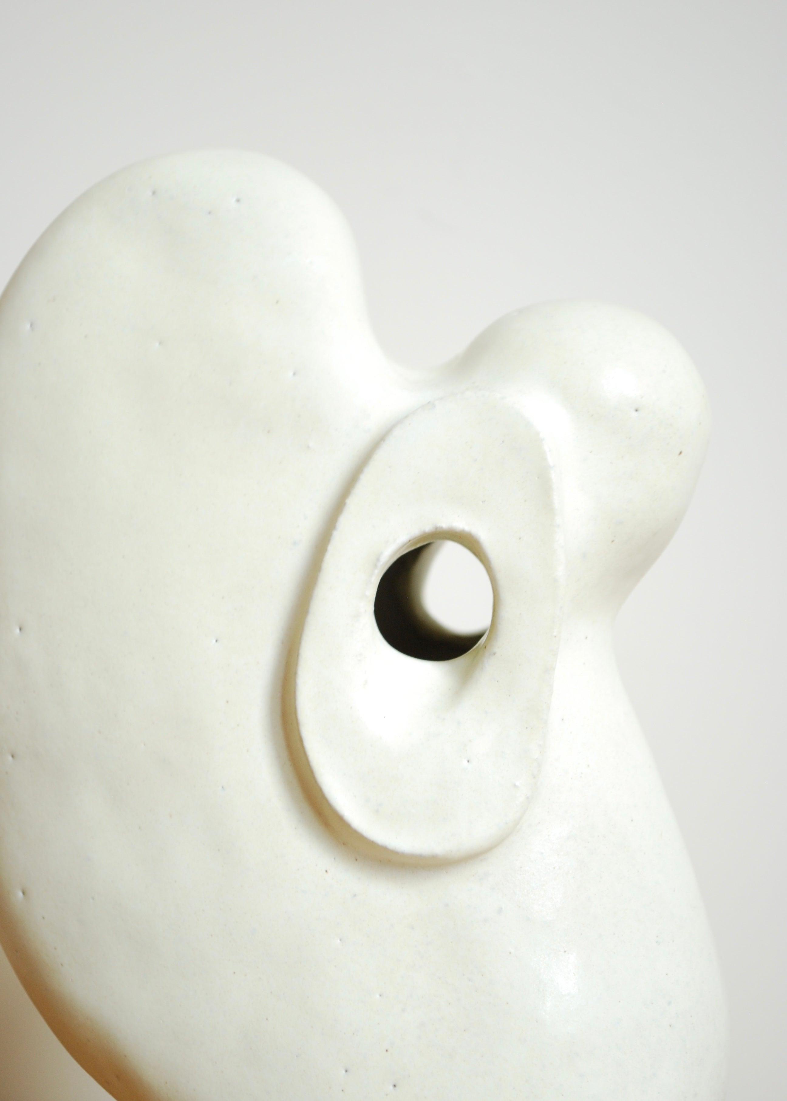 organic shape multi hole handmade ceramic vase in cream glaze