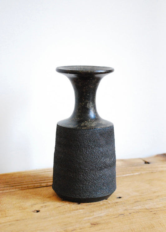 Handmade ceramic vase in textural black clay with a tenmoku glaze and spout at top 